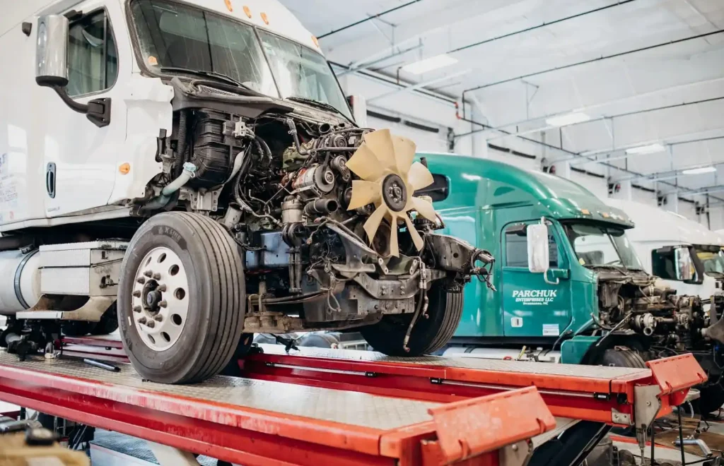 White semi-truck on a lift for professional truck & trailer repair near me at RoadX Truck Repair.